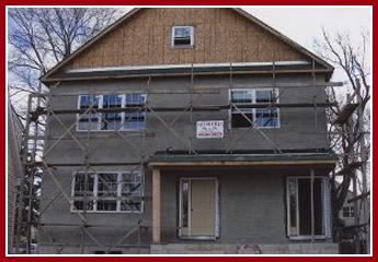 House Stucco Being Repaired